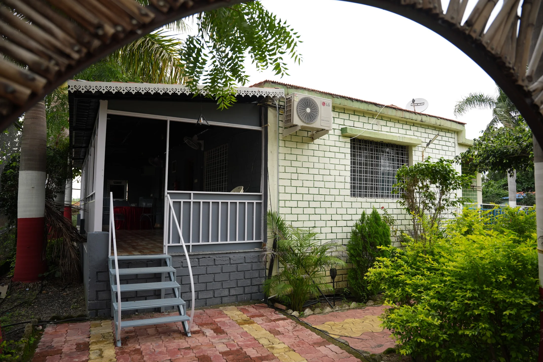 DS Bungalow exterior at DS Agro Tourism & Resort. The private bungalow entrance and surrounding greenery.