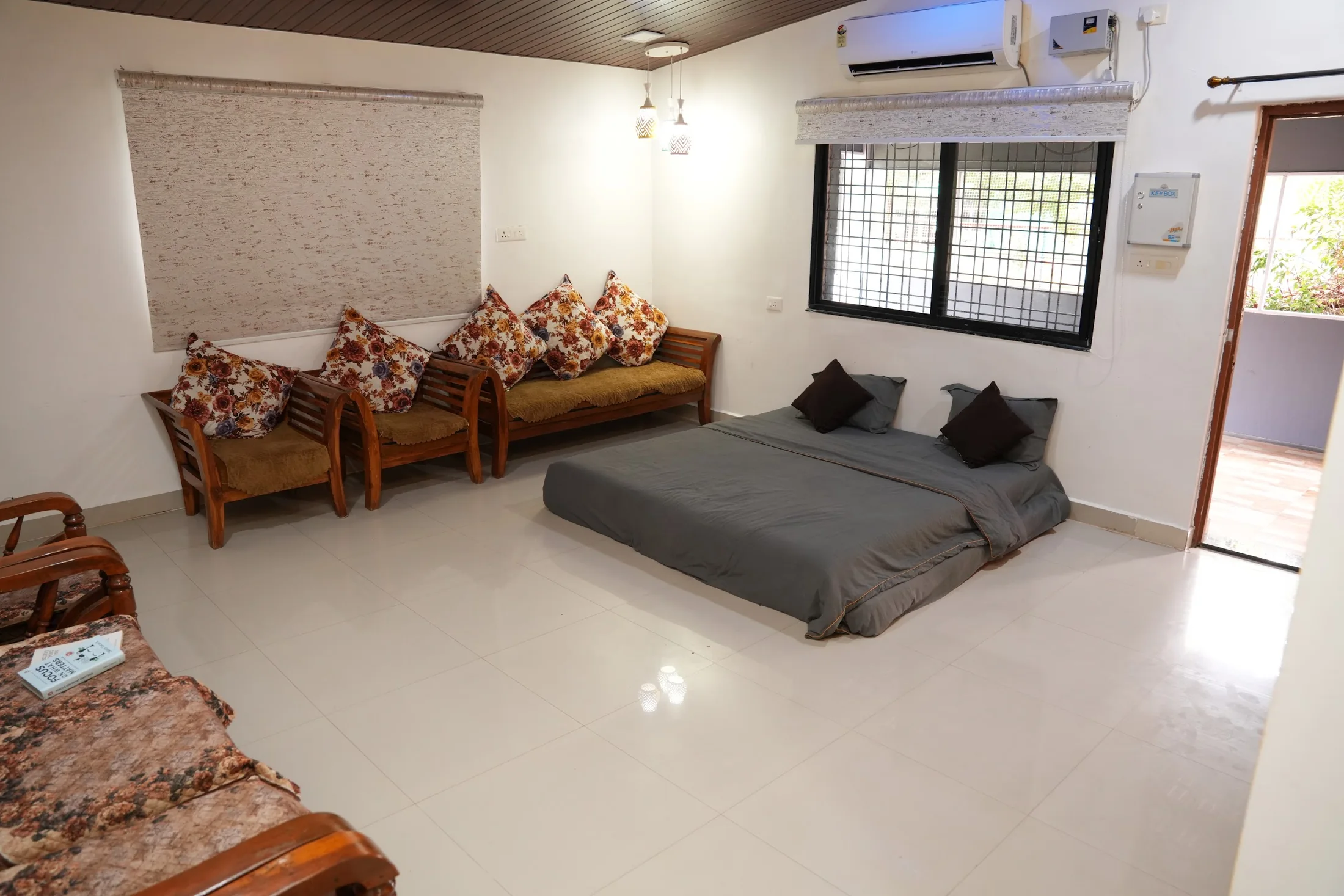 Living area overview at DS Agro Tourism & Resort. Seating and open floor space for families and groups.