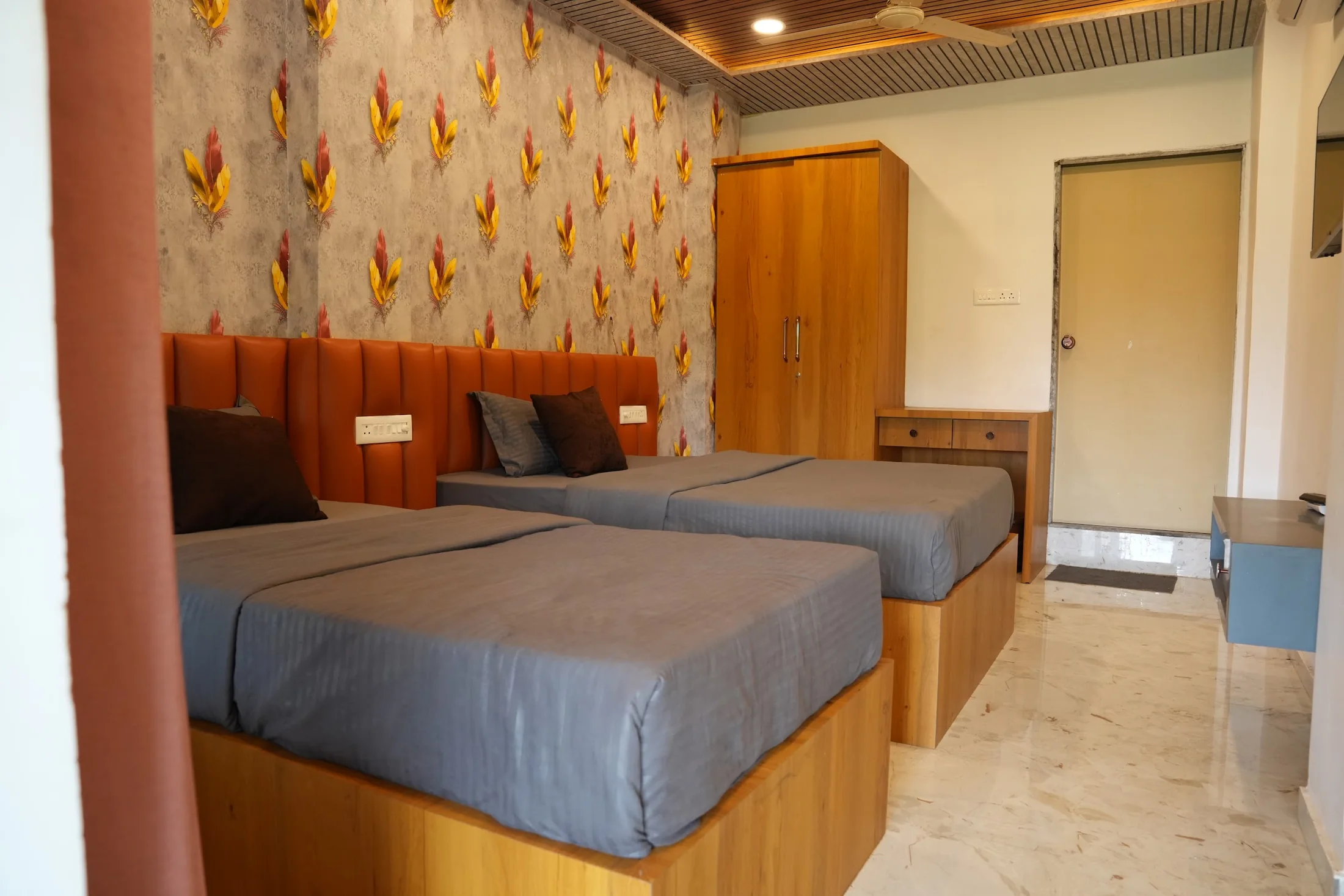 Deluxe twin room wide view at DS Agro Tourism & Resort. A complete view of one of the twin-bed Deluxe rooms.