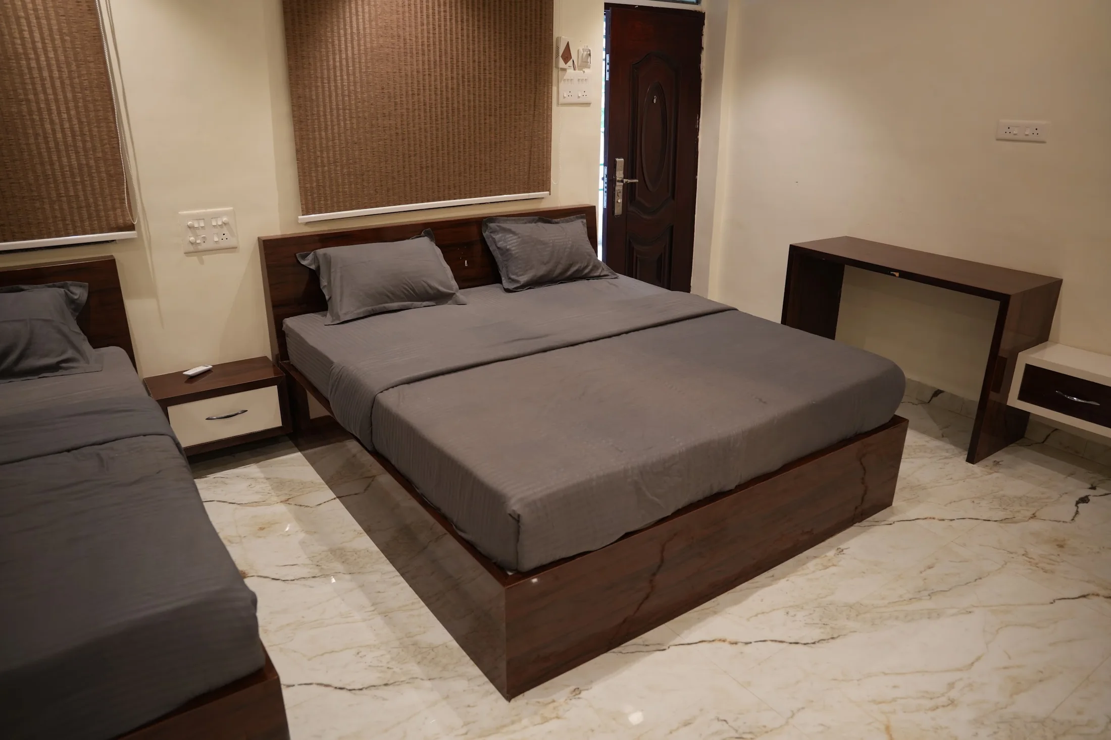 Premium bed detail at DS Agro Tourism & Resort. A closer look at the bed and headboard.