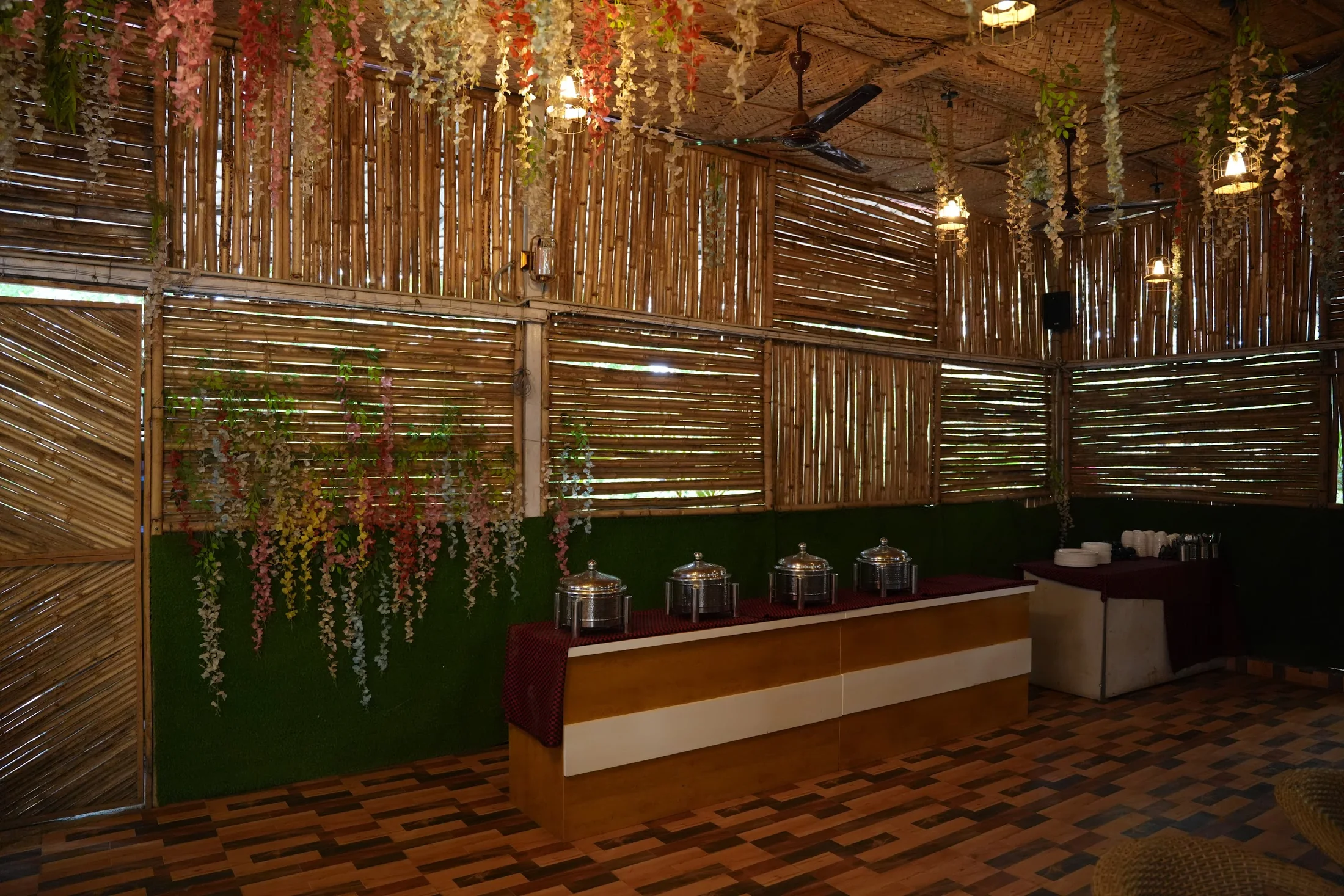 Serving area at DS Agro Tourism & Resort. The meal-service counter inside the dining space.