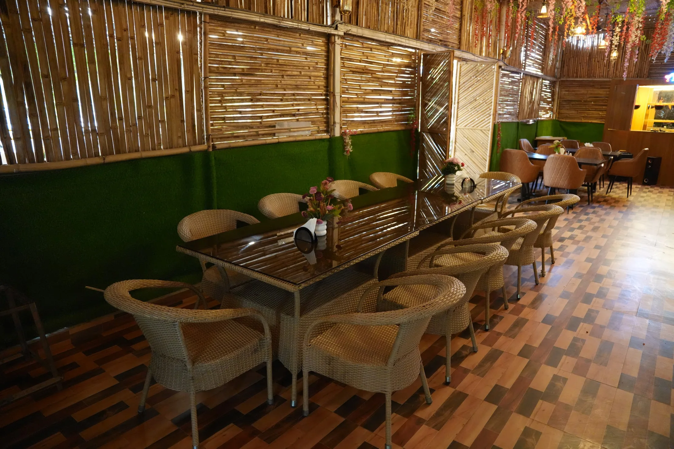 Warmly lit seating in the resort dining space