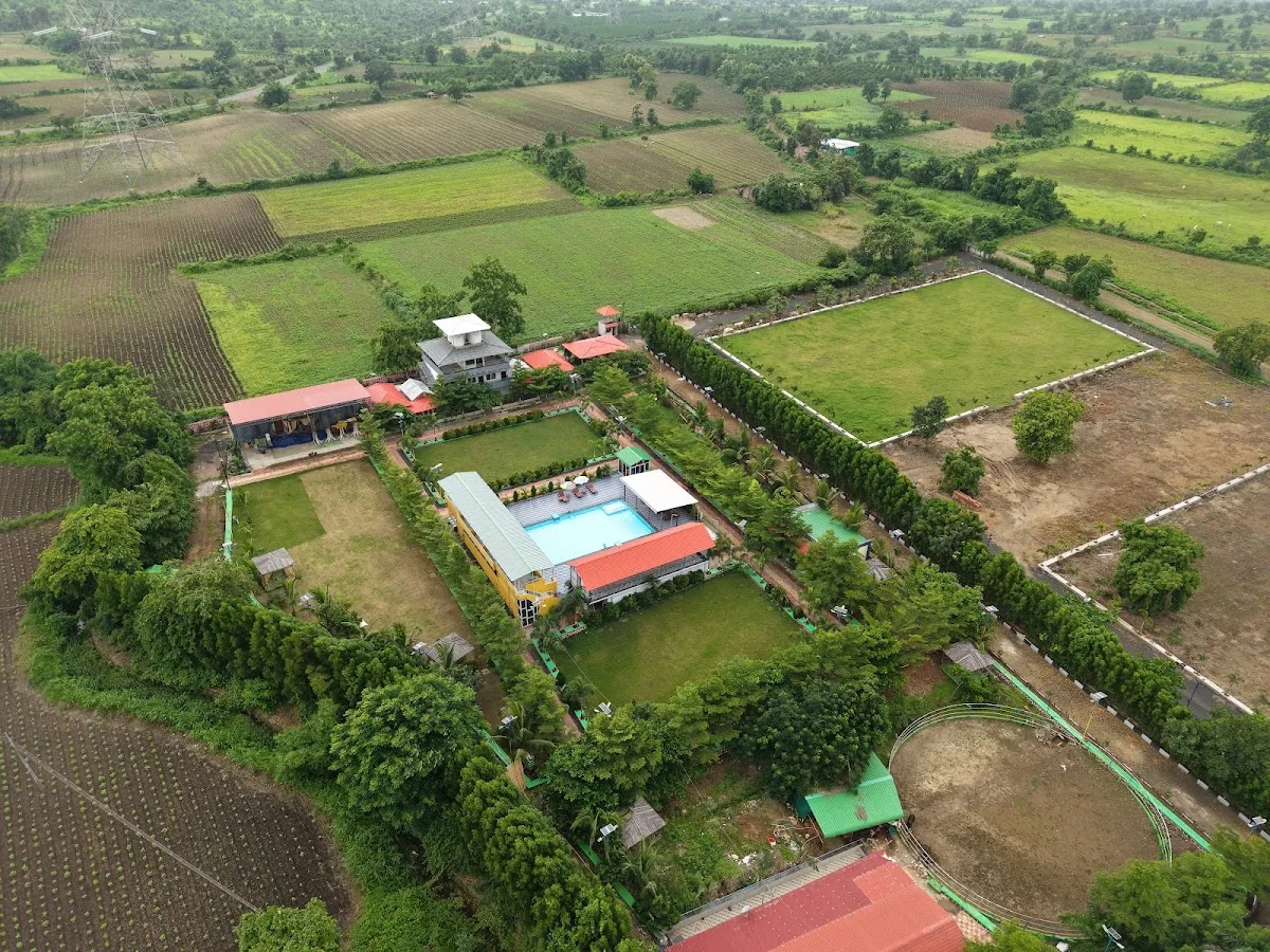 Resort from above at DS Agro Tourism & Resort. The complete property framed by green fields.