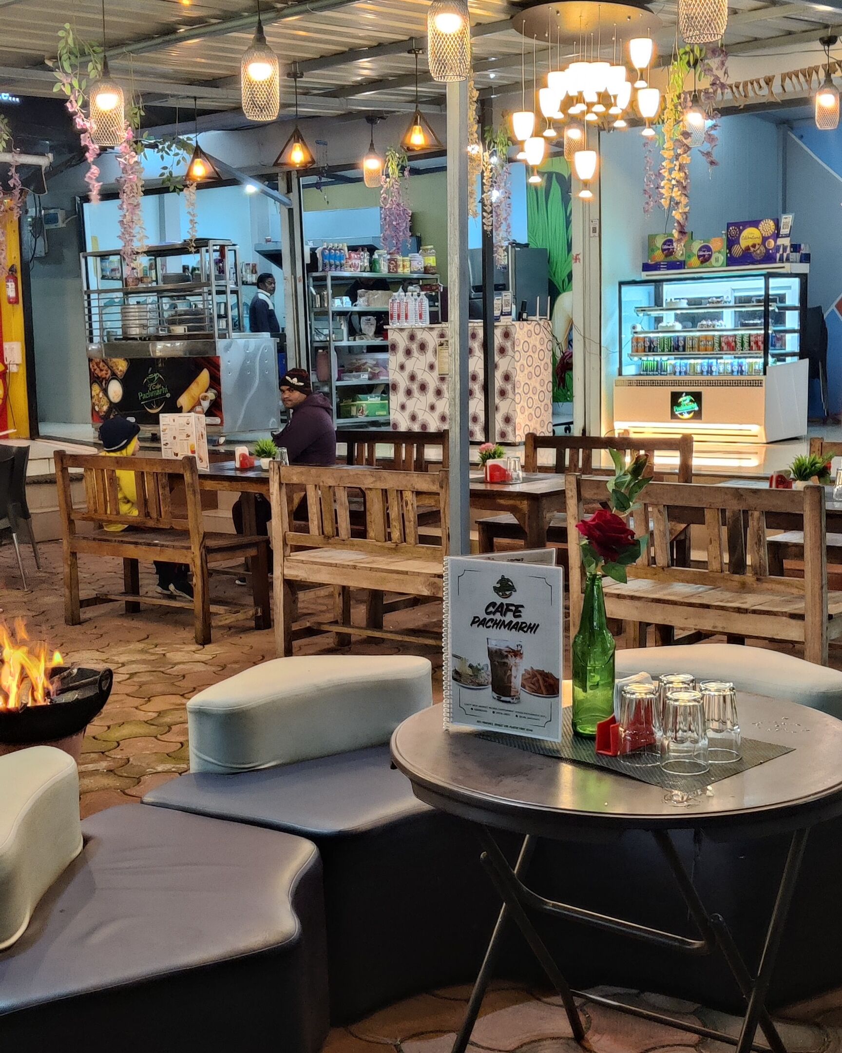 Seating and counter inside Cafe Pachmarhi